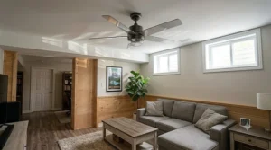 An educational diagram explaining CSA and ETL damp-rated certifications for a ceiling fan for high humidity basement use.