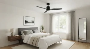 Matte black ceiling fan without light kit mounted on a white bedroom ceiling, offering a minimalist look.