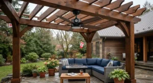 Damp-rated weather-resistant gazebo ceiling fan mounted in a wooden backyard pergola for year-round Canadian outdoor living.