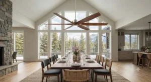 Large wooden blade ceiling fan circulating air in an open-concept Canadian dining space with tall ceilings.