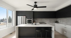 A sleek matte black kitchen ceiling fan with light centered above a modern kitchen island.