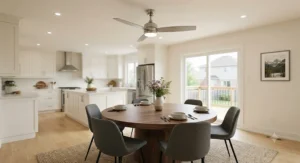 Brushed nickel casual dining room ceiling fan circulating air in a spacious open-concept Canadian suburban kitchen and dining room.