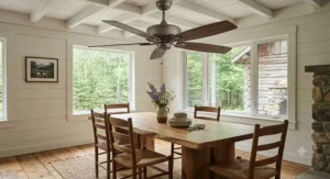 Rustic casual dining room ceiling fan featuring dark wood-grain blades in a cozy cottage-style Canadian dining area.