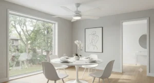 A sleek white ceiling fan for a dining room blending seamlessly with a minimalist, bright interior design.