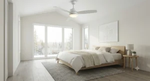 White ceiling fan with light styled in a bright, minimalist Scandinavian master bedroom