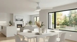 Minimalist white dining room ceiling fan with remote control in a bright, open-concept Canadian home.
