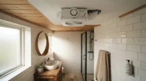 Compact bathroom exhaust fan fitted in a small downtown apartment bathroom to control humidity.