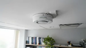 A low profile flush mount home office ceiling fan installed in a room with a lower ceiling.